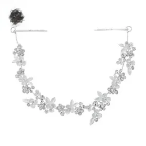 Detail of silver bridal hair vine with frosted white flowers and sparkly rhinestones