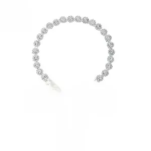Detail of bridal headband with silver rhinestones and white silk ribbon for hairstyling