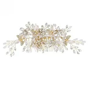 Detail view of bridal hair comb with gold petals, white pearls, and sparkling crystals