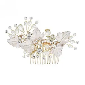 Detail of bridal hair comb with acrylic flowers, faux pearls, and sparkling rhinestones