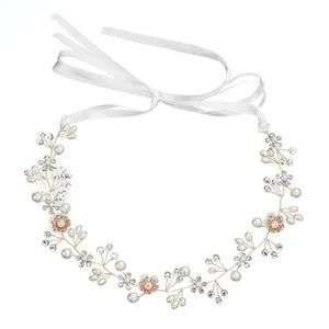 Detail of bridal headband with gold wires, white pearls, crystals and silk ribbons