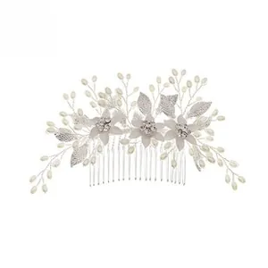 Detail of silver bridal hair comb with handmade flowers, pearls and crystal accents