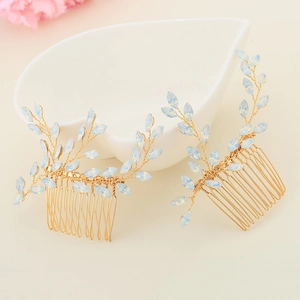 Elegant bridal hair comb set with blue crystal leaves and gold wire floral design