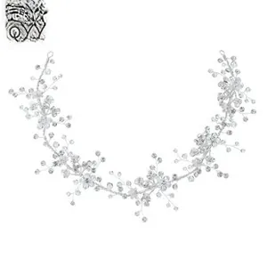 Close-up of flexible silver bridal hair vine with crystal beads and floral wire design