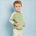 Close-up of a kids long sleeve sports jacket with light green and beige patchwork