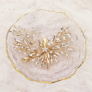 Handmade bridal hair clip with sparkling rhinestones and golden leaf floral design