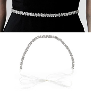 Detail of bridal crystal waist belt with silver rhinestones and white chiffon ribbons
