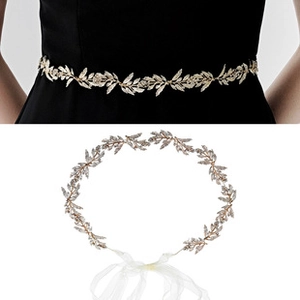 Close-up of a gold metal leaf waist chain with white rhinestones and silk ribbon ties