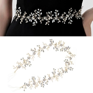 Detail of floral bridal waist belt with white pearls and sparkling rhinestones