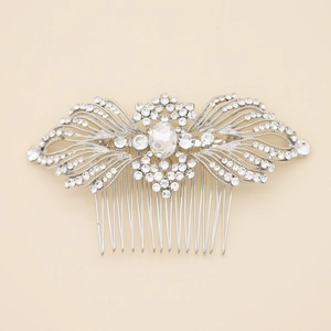 Close-up of bridal hair comb with silver alloy base and glittering white rhinestones