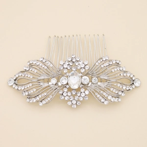 Vintage silver bridal hair comb with ornate rhinestone wings and central oval gemstone