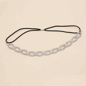 Macro detail of silver bridal headband featuring interlocking infinity rhinestone patterns
