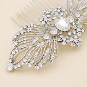 Macro view of crystal rhinestones on a vintage floral silver alloy bridal hair comb
