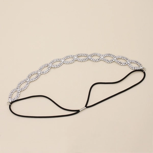 Detail view of woven rhinestone bridal headband with flexible black elastic strap