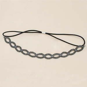 Detail of vintage rhinestone elastic headband featuring hollow wave patterns and crystals