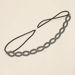 Close-up of bohemian rhinestone headband with interlocking rings and elastic strap