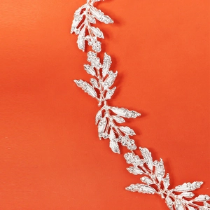 Silver leaf wedding belt with sparkling crystals on a vibrant orange background