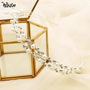 Detail of silver bridal headband with pearls and crystals on vine leaf double layer band