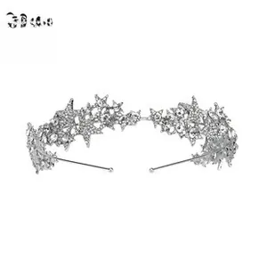 Detail of silver bridal headband featuring intricate crystal star patterns and branch design