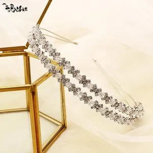 Close-up of double-row rhinestone headband with crystal beads on a glass jewelry box