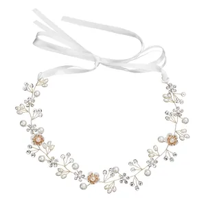Elegant bridal hair vine with metal flowers, pearls, and crystals on a gold wire base