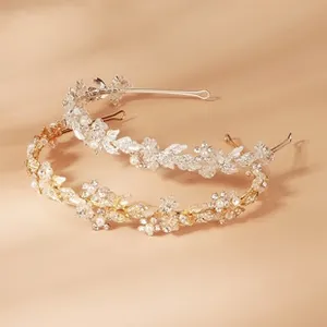 Detailed view of bridal leaf headbands with sparkling crystals and artificial pearls