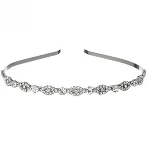 Detailed macro view of thin silver metal headband encrusted with sparkling rhinestones