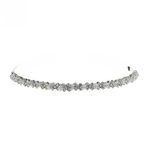 Close-up of silver bridal headband with sparkling crystals and geometric branch patterns