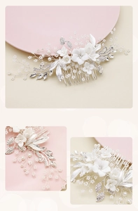 Close-up of handmade bridal hair comb with ceramic flowers and silver crystal leaves