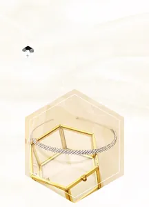 Detail of three-row crisscross sparkling rhinestone headband on a glass case