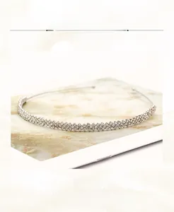 Detailed view of silver rhinestone headband with interlocking double row bead design