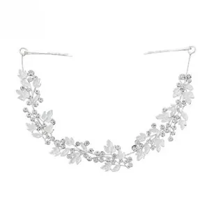 Close-up of silver bridal headband with leaf vine design and shimmering cubic zirconia