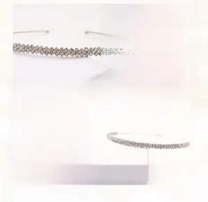 Detail of silver rhinestone headband featuring layered copper wire and sparkling crystals