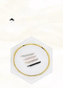 Detail view of sparkling rhinestone hair clips set in silver, gold, and rainbow colors
