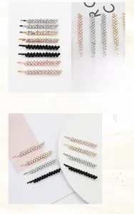 Close-up of sparkling rhinestone hair clips in silver, rose gold, and gunmetal finishes