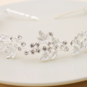 Elegant silver bridal headband with crystal leaf motifs for wedding and evening party