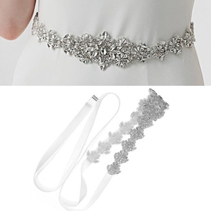 Detail of bridal rhinestone belt featuring silver metal claw chain and white crystals
