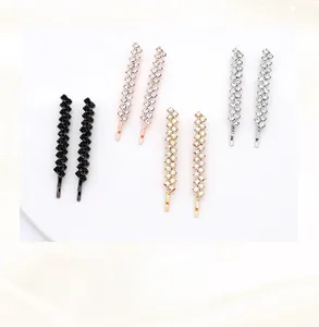 Detail of four pairs of handcrafted rhinestone hairpins in gold and silver finishes