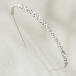 Elegant geometric silver headband with crystals on a thin metal frame for women