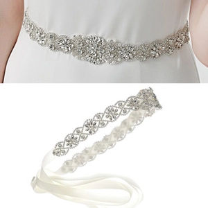 Close-up of luxury bridal sash with sparkling rhinestones and elegant white satin ribbon