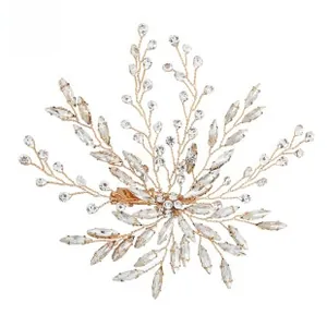 Detailed view of handmade crystal bridal hair clip with gold wire and beaded leaves