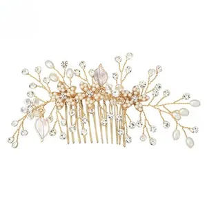 Detail of bridal hair comb with gold wires, white faux pearls and clear rhinestones