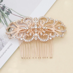 Detailed macro view of vintage gold bridal hair comb with sparkling white crystals
