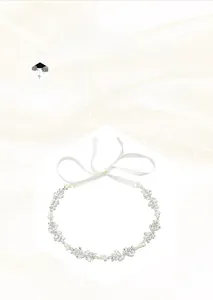 Detail of handmade bridal belt with marquise rhinestones and pearls on silver leaves