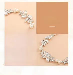 Macro detail of handmade bridal hairpiece with rhinestone leaves and white pearls