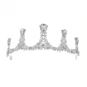 Close-up of bridal tiara featuring silver alloy floral patterns and five teardrop diamonds