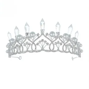 Detailed view of bridal tiara with silver leaf pattern and white pearl accents