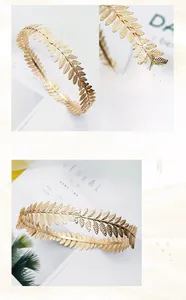 Detail of the golden metal leaf crown showing handcrafted texture and polished leaf finish