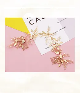 Detail of handmade gold bridal hair combs with pearls and metal leaf design for weddings