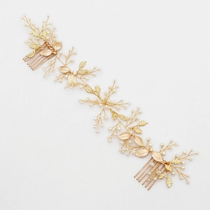 Elegant gold bridal hair comb with handmade pearls and golden leaves on white background